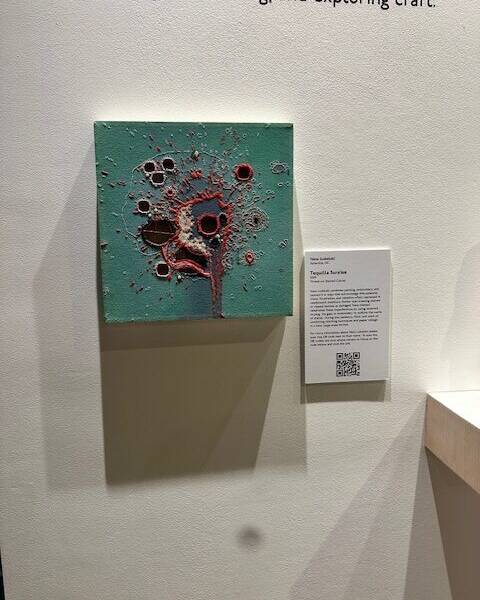 An art piece on the wall in gallery.